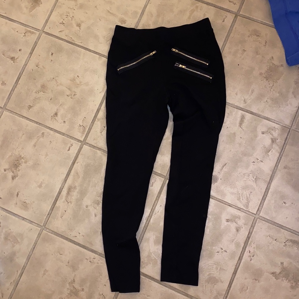 Black leggings with zippers on the front